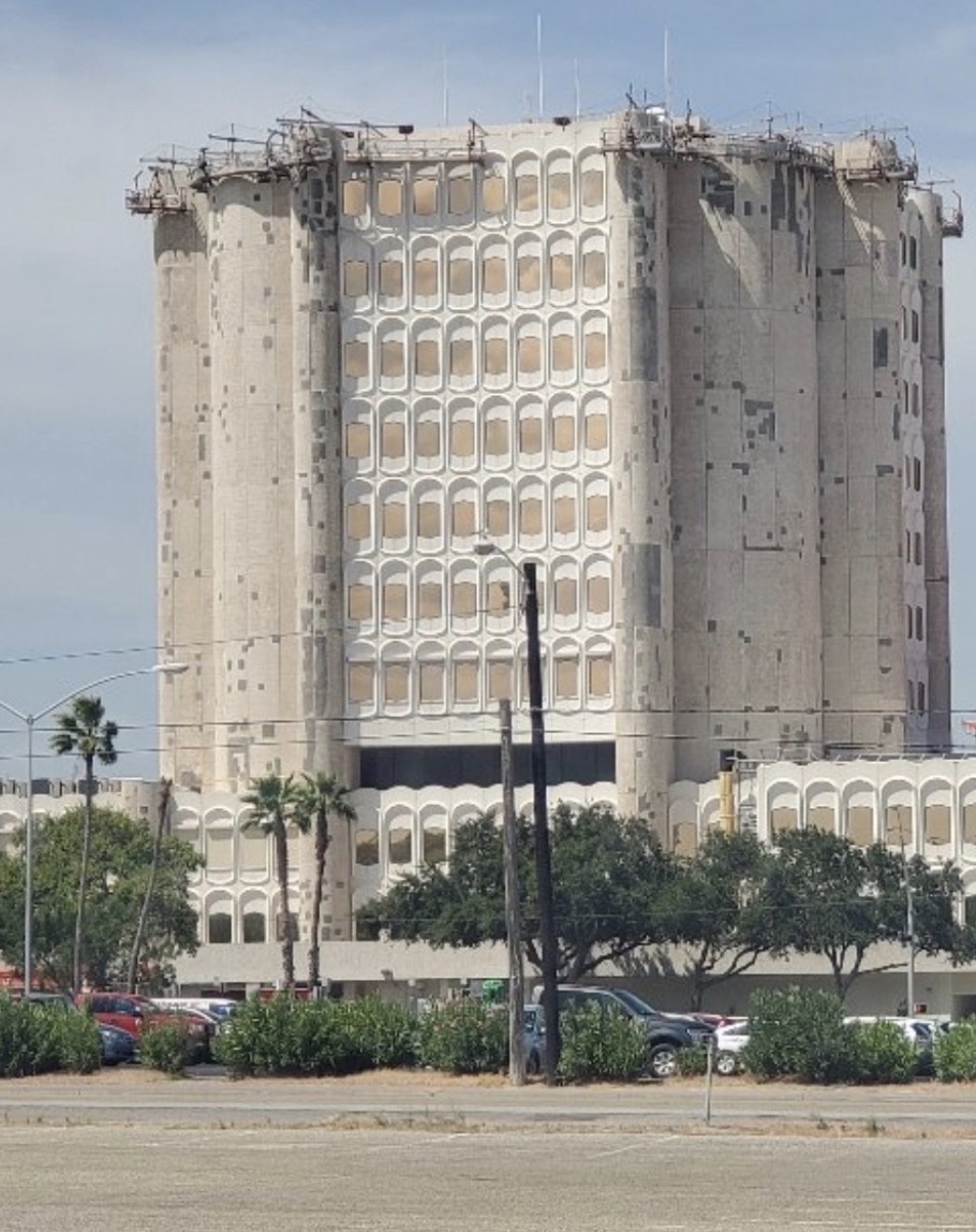 Commercial building facade with work platforms during exterior renovation