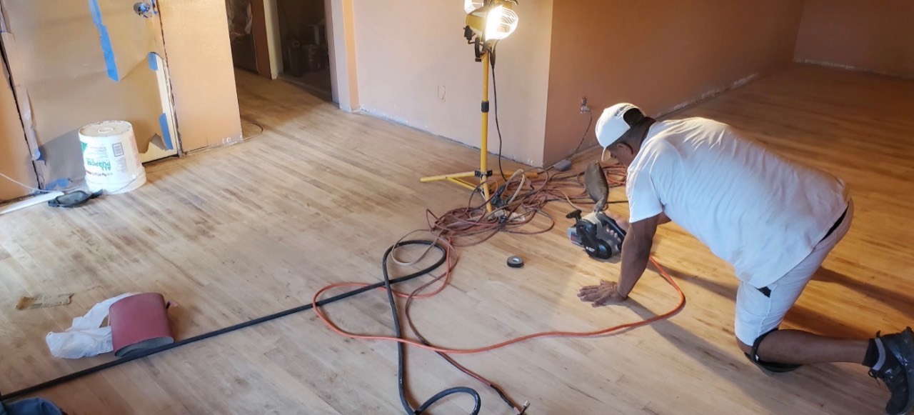 Wood flooring being sanded during refinishing